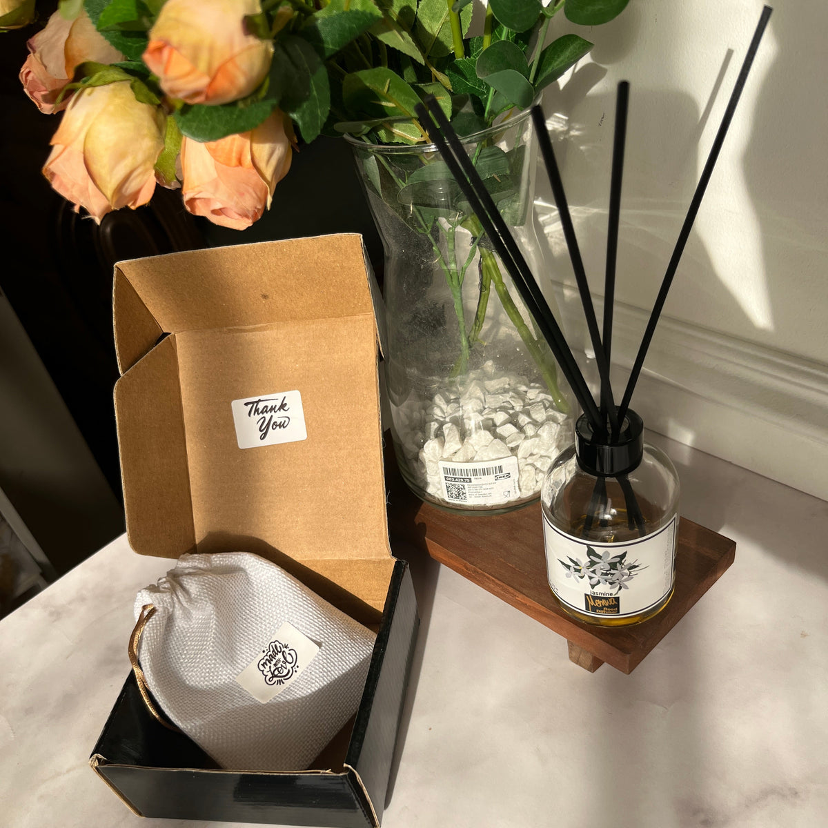 Sticky Memories existing gift packaging with a drawstring pouch in an open box